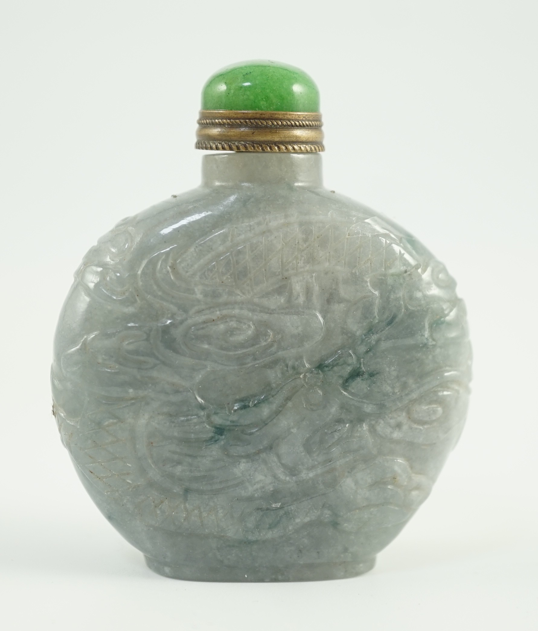 A Chinese jadeite ‘dragon’ snuff bottle, c.1800-1900, 4.9cm high, jadeite mounted stopper